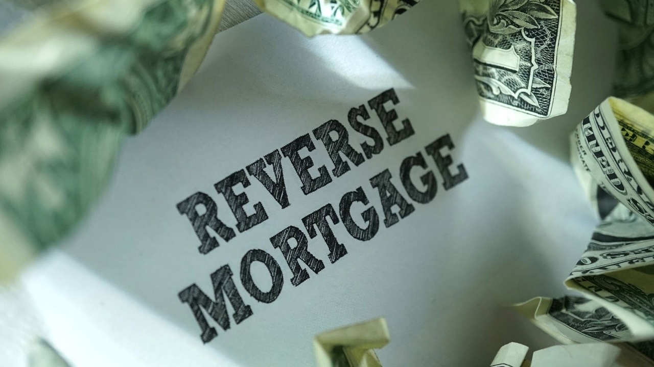 paper with the words reverse mortgage on money